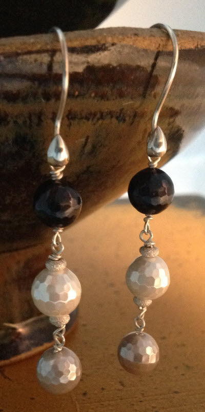 Black Cream and Silver Faceted Pearl Sterling Earrings on pottery
